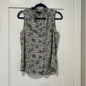 Banana republic sleeveless blouse. B&W floral print with ruffle neckline.